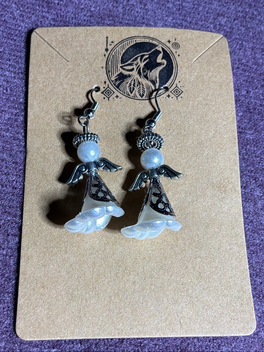 Pearl White Angel Drop Earrings with Silver Accents